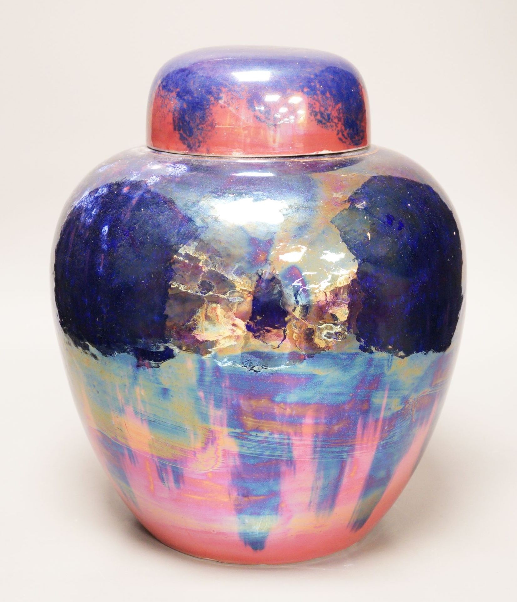 A large Carlton Ware pink and purple lustre ginger jar and cover, 32cm tall